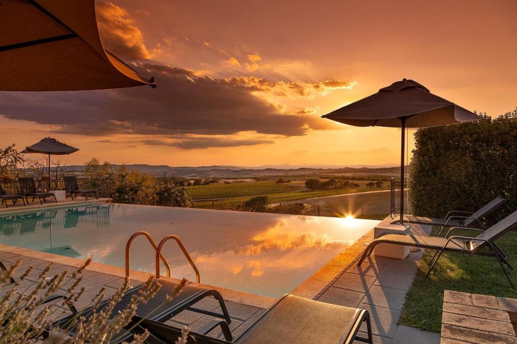Palazzo Massaini - La Pieve pool at sunset
