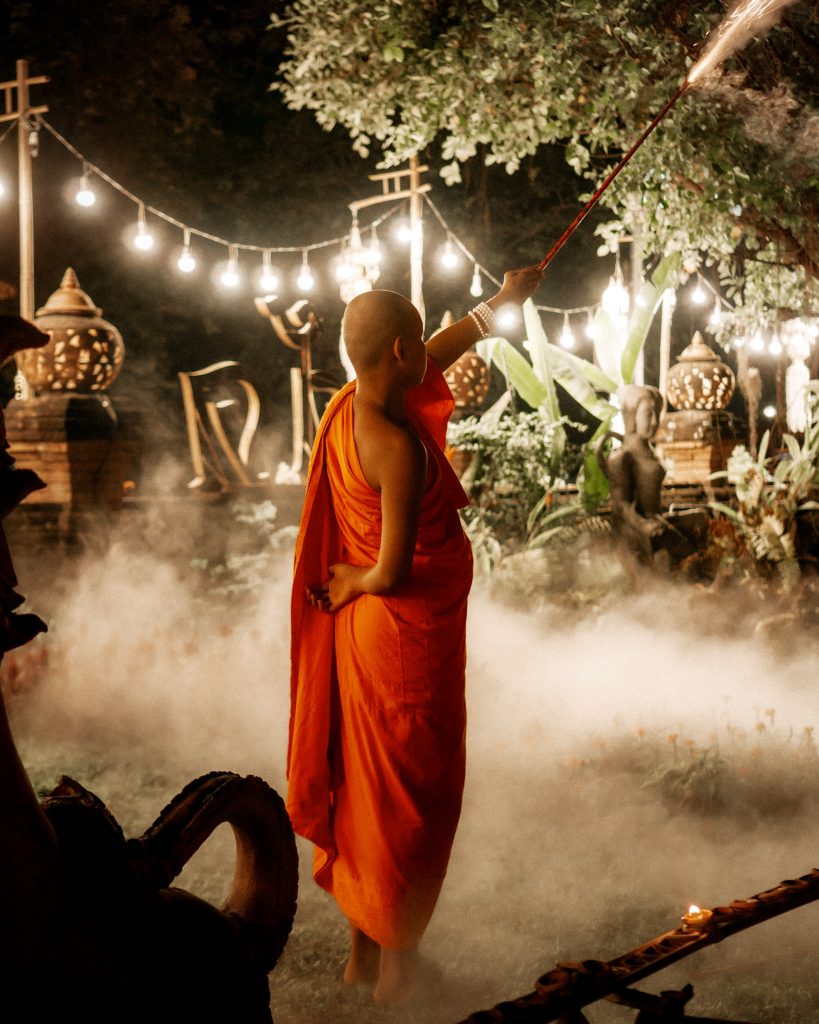 Monk setting off fireworks in Chiang Mai, Thailand