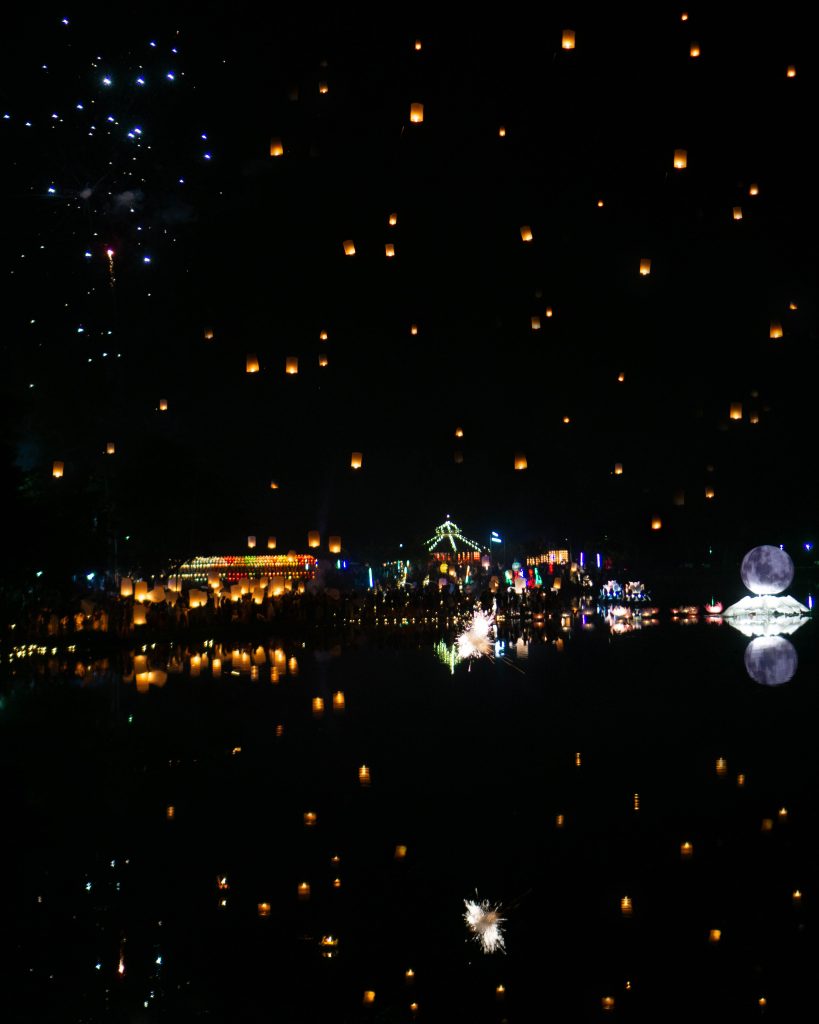 Yi Peng Festival in Doi Saket. Hundreds of Lanterns floating in the sky and reflected on the lake below.