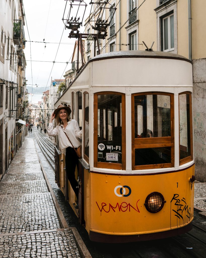 Riding a yellow tram in Lisbon