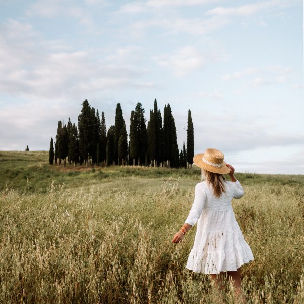Aga in front of the cypress tress in Val d'Orcia, Tuscany
