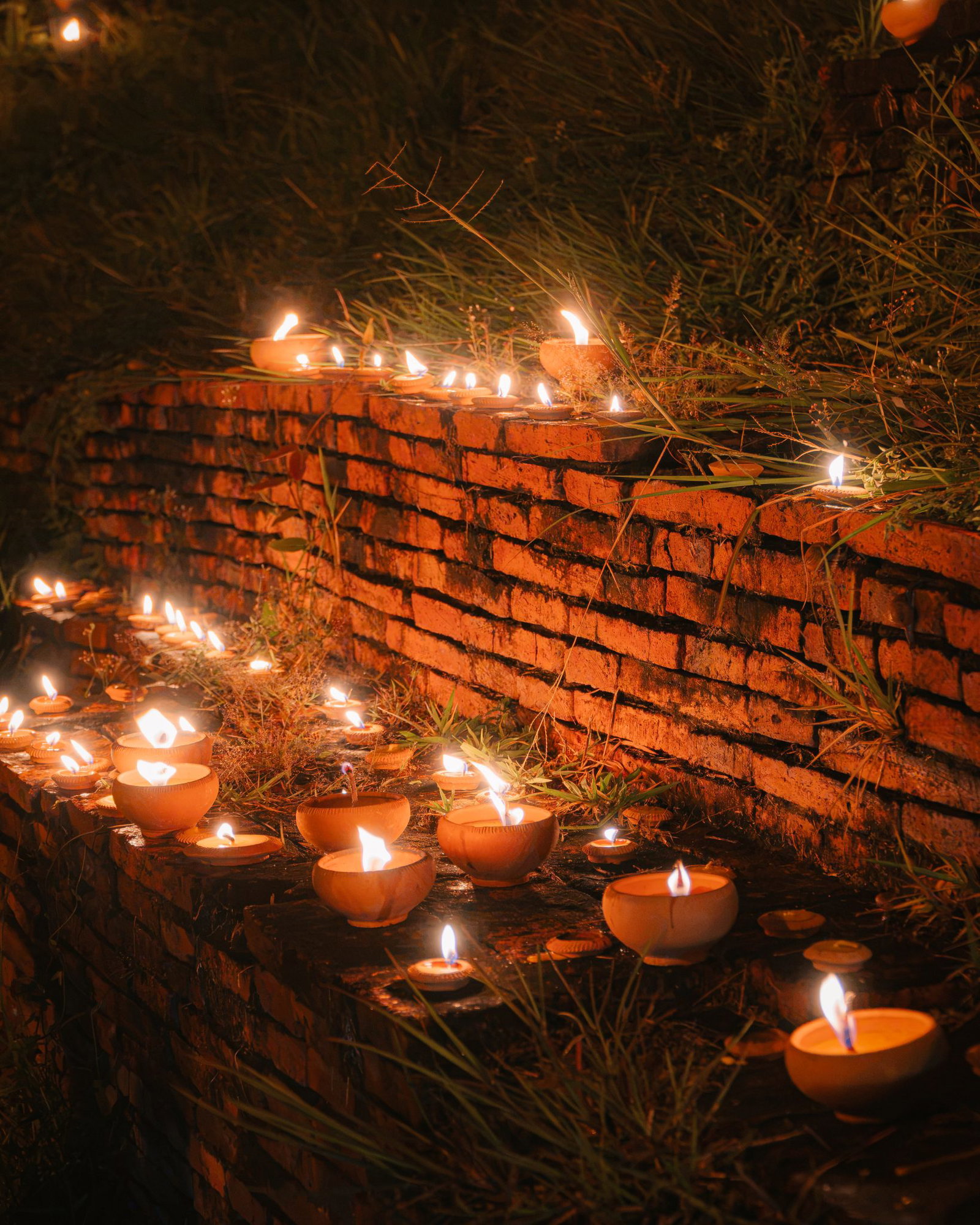 Candlelight on the city walls in Chiang Mai during Yi Peng
